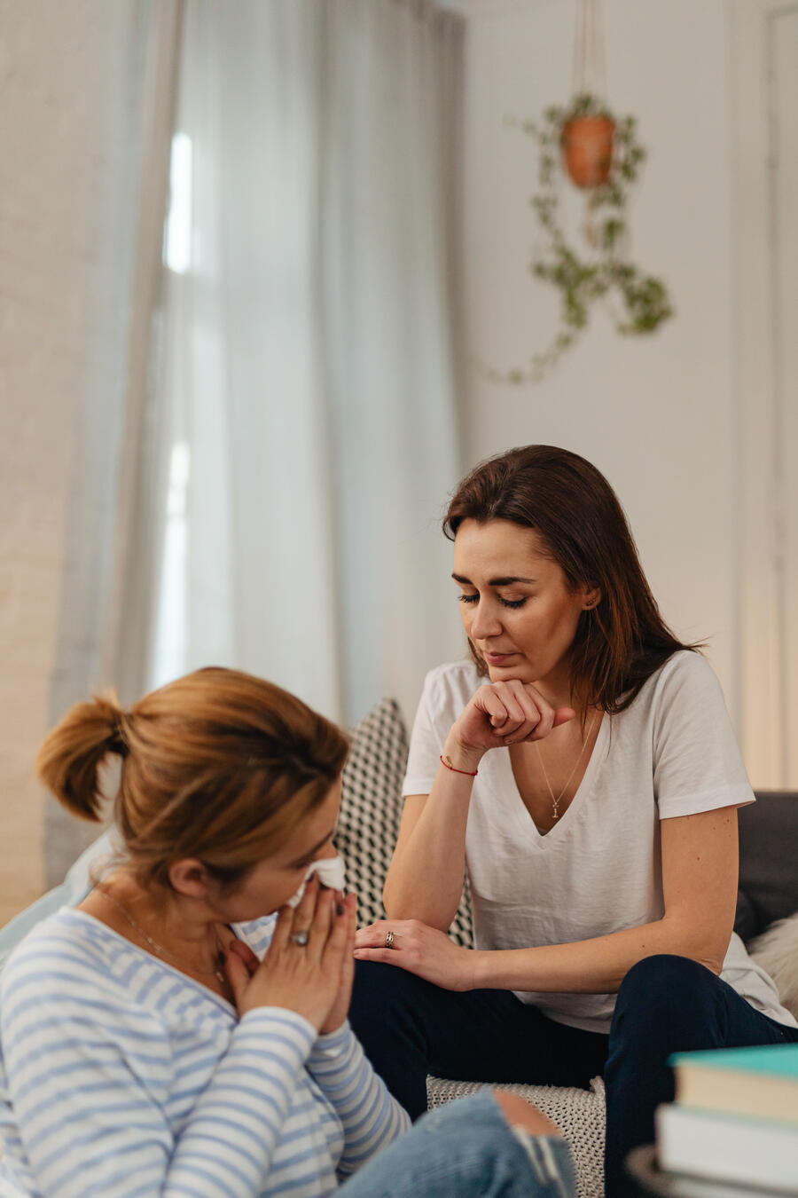 Two women engaged in compassionate conversation, representing spiritual companionship, deep listening, ethical presence, and support for the inner life.